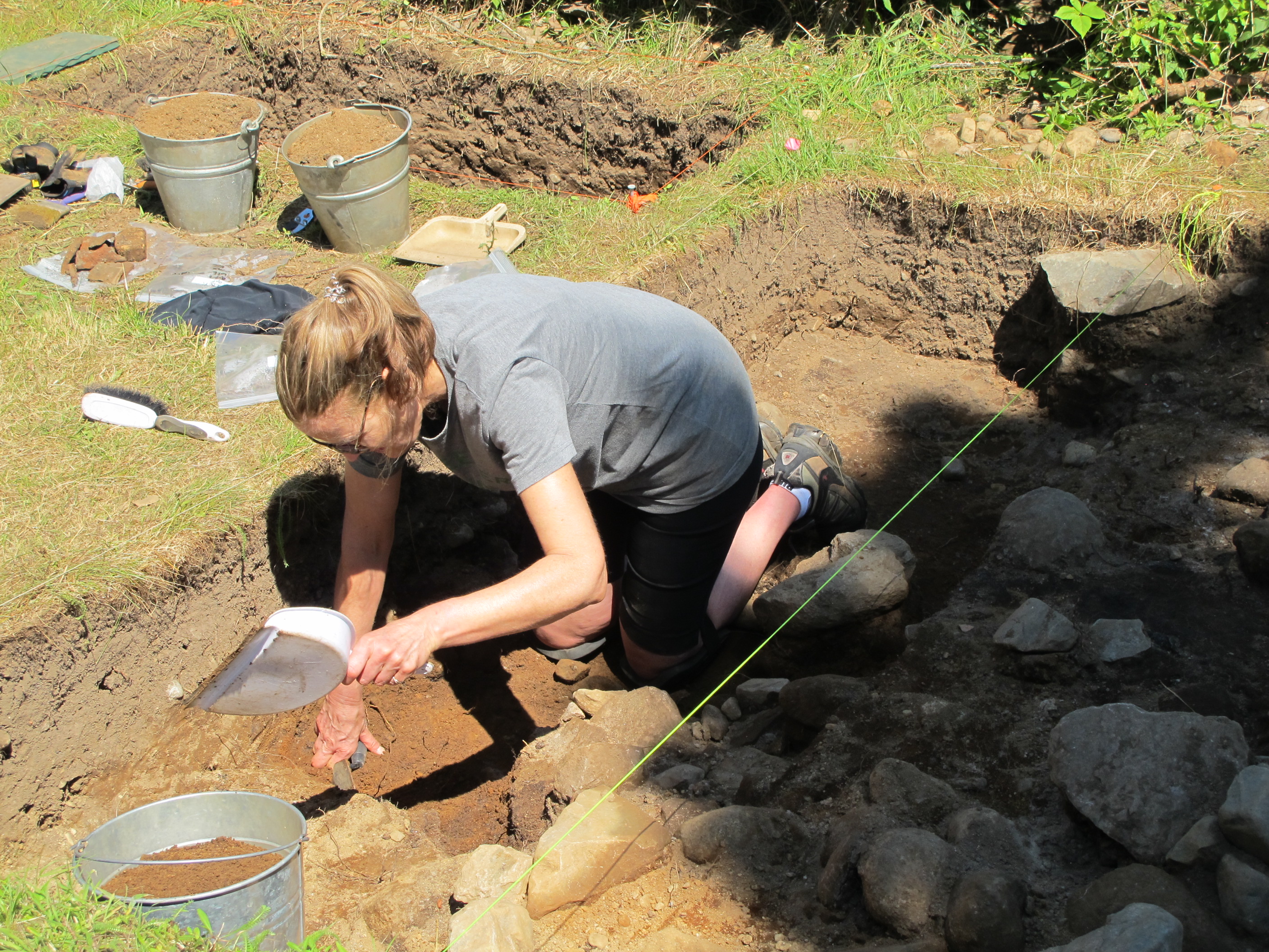 Heather of AFN joined us again this year. Today she is working in an area where we uncovered a new stone wall.