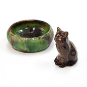 Image of a small ceramic bowl and cat.