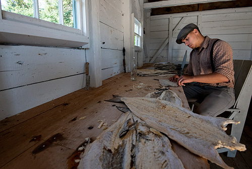 Young man saling fish