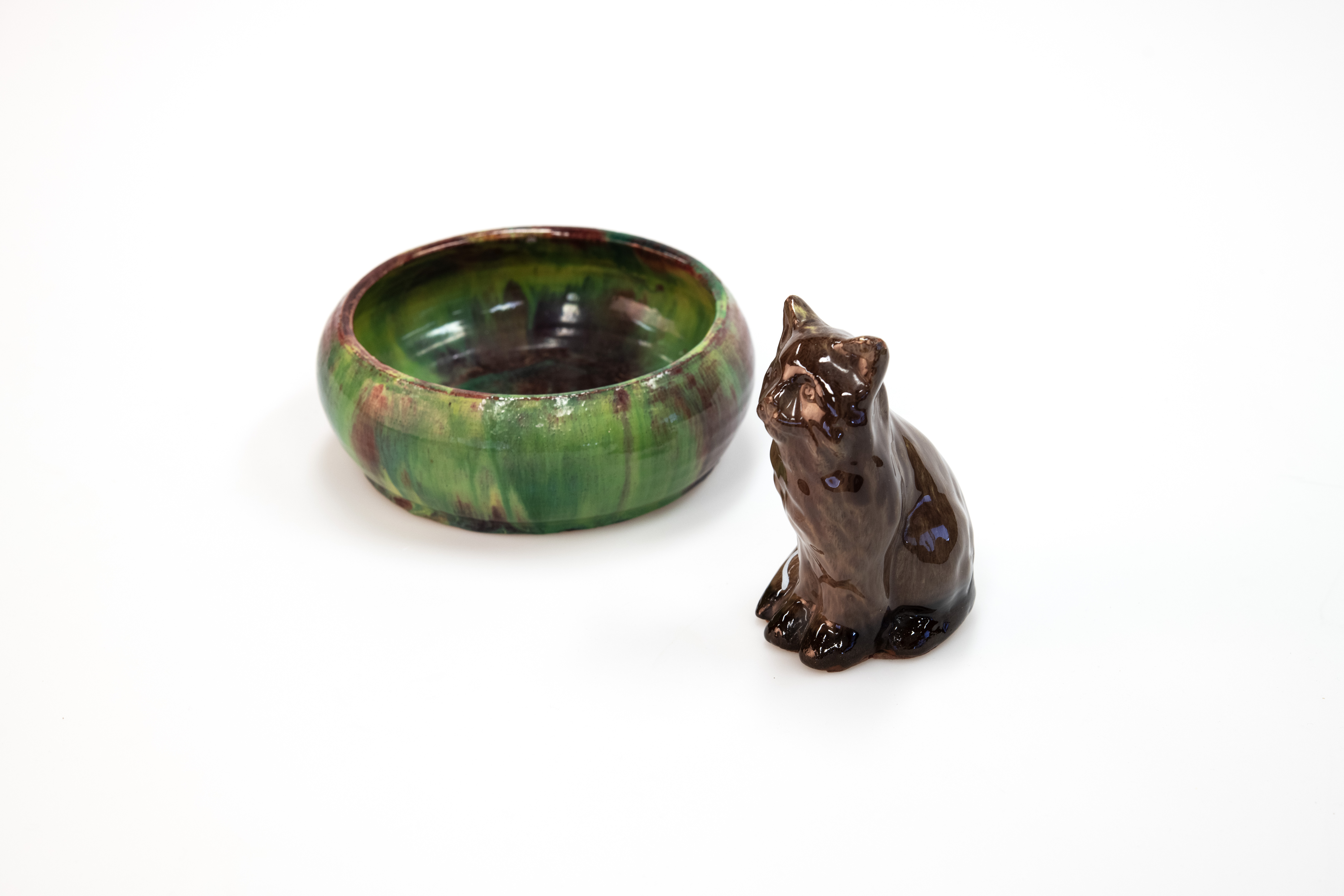 Image of a hand made ceramic cat and bowl.