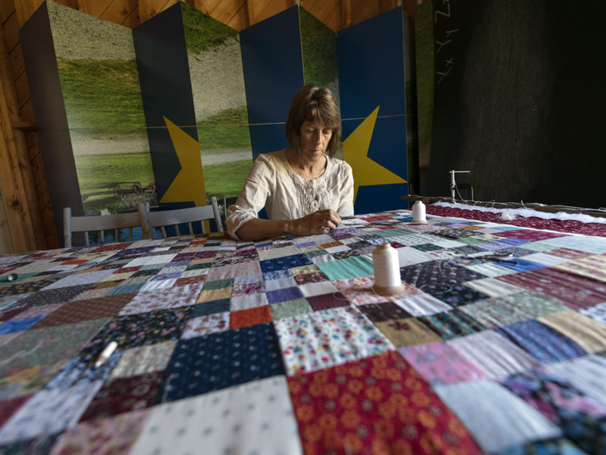Woman working on a large quilt