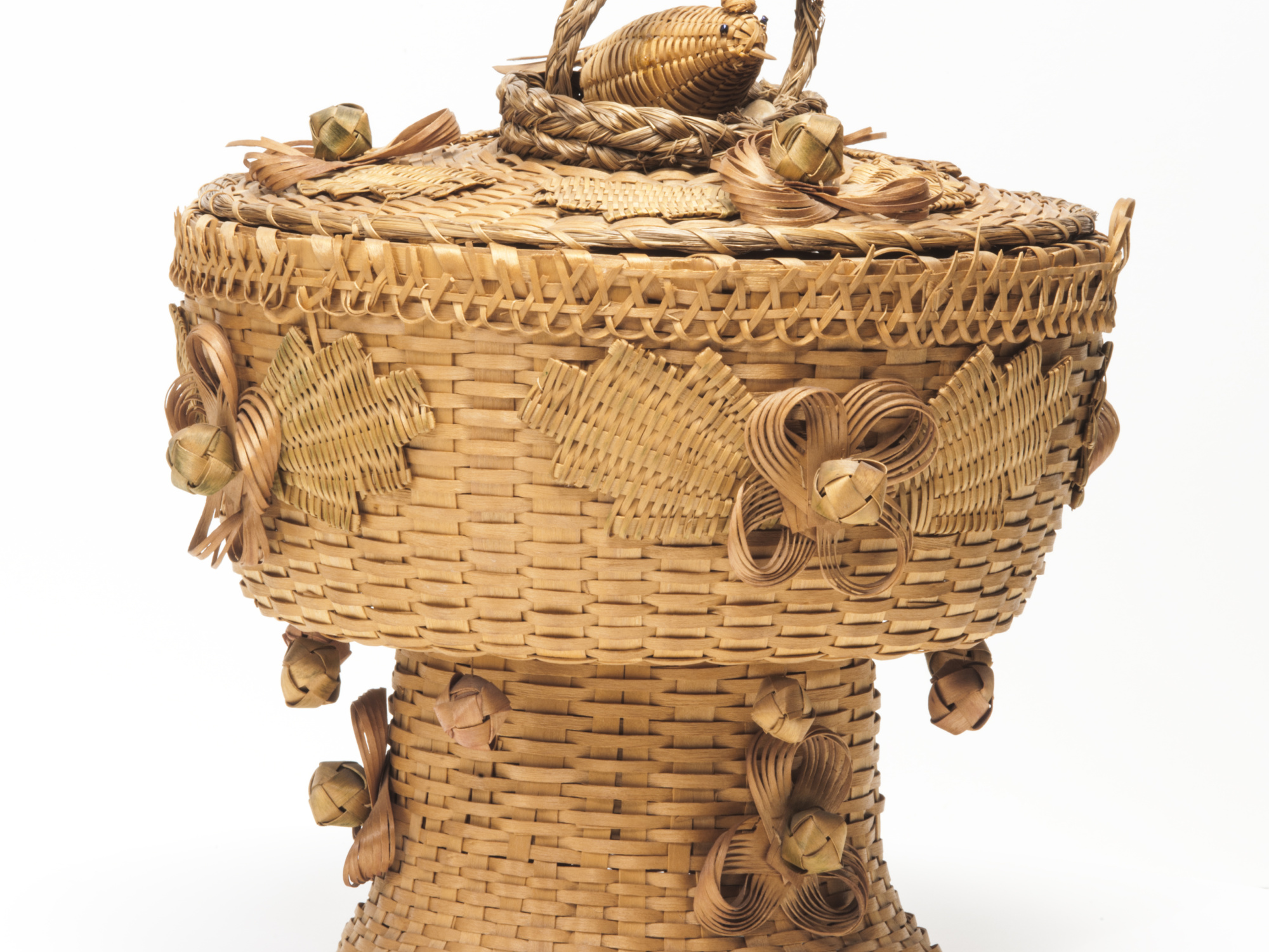 Sewing basket, with hanging balls, decorative rosettes and nesting bird.