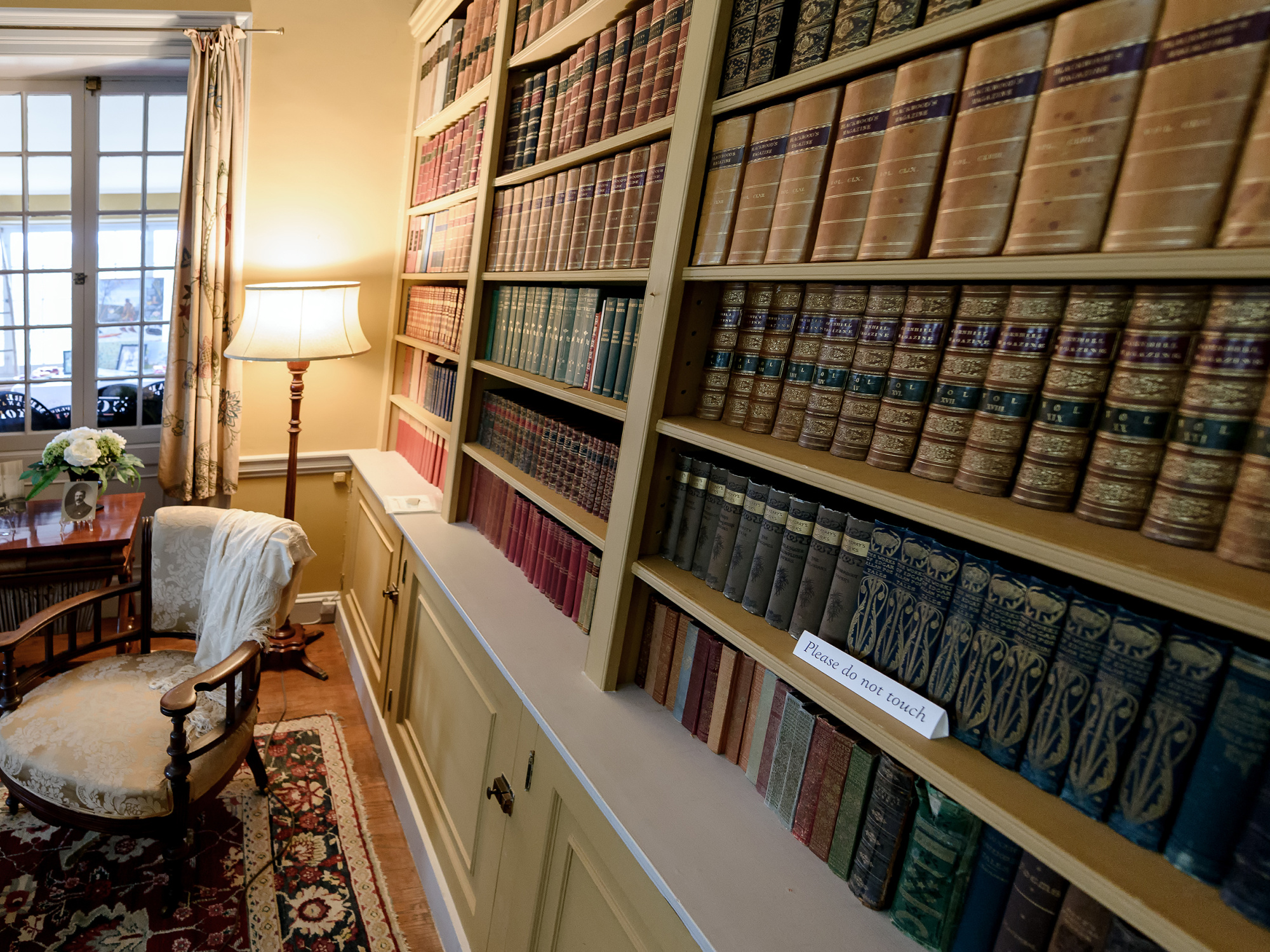 Library featuring a wall of bookcases at Prescott House Museum 