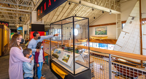 Masked family looking at model ships at the Maritime Museum of the Atlantic.