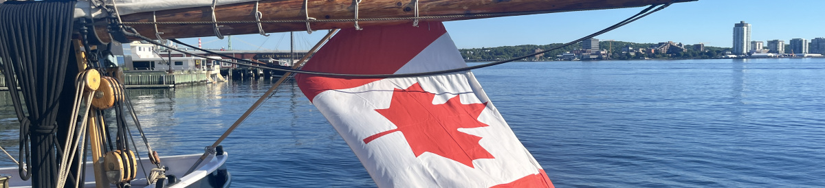 Canadian flag hanging off the bow of the Bluenose II.