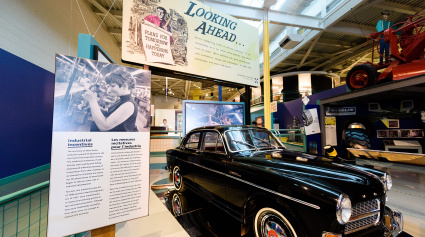 Museum exhibit displaying an antique car