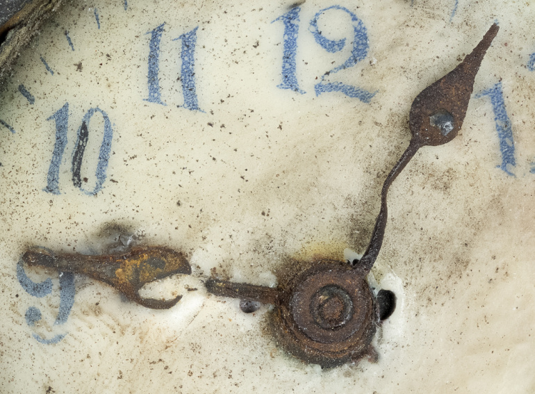 Clock found in explosion wreckage, back.