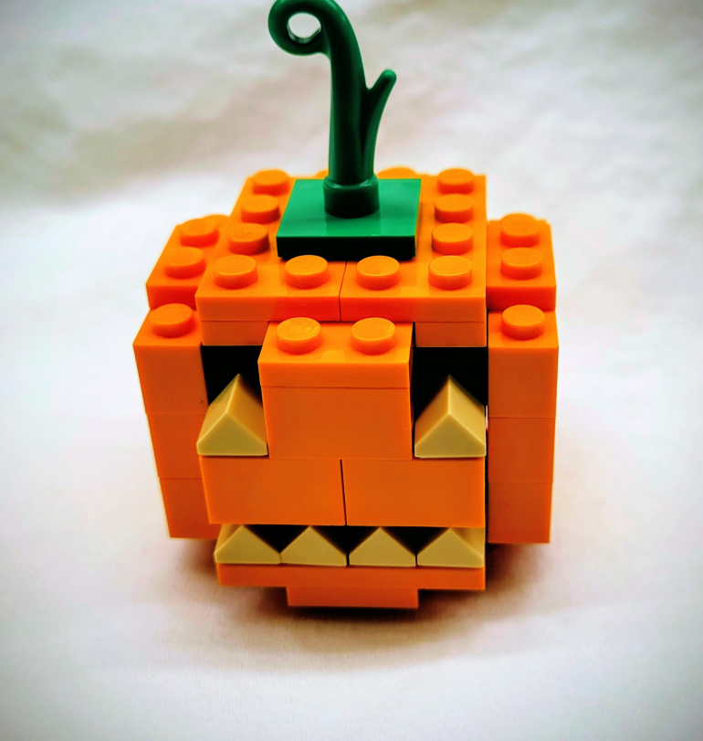 A small jack o' lantern made of LEGO.