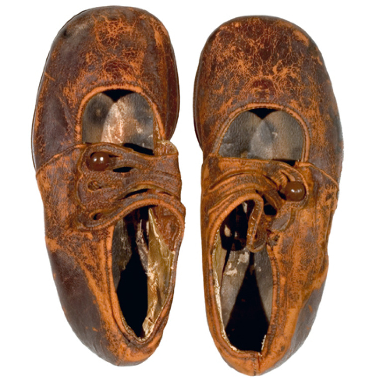 top view of a pair leather children’s shoes is believed to be from Body No. 4, the “Unknown Child”