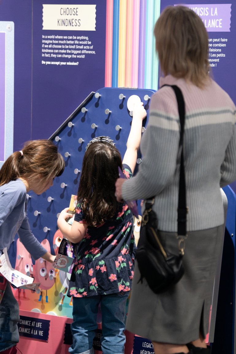 Girls explore an interactive station in the Mighty Engine exhibit.