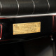 Volvo Canadian, red leather interior. interior detail plaque