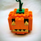 A small jack o' lantern made of LEGO.