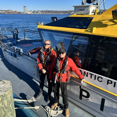 Ross Macfadden & Ian Wallace standing on a wharf.