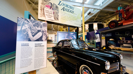 Museum exhibit displaying an antique car