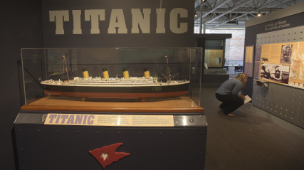 Entrance to the exhibit Titanic: The Unsinkable Ship and Halifax, model of the RMS Titanic in the foreground.