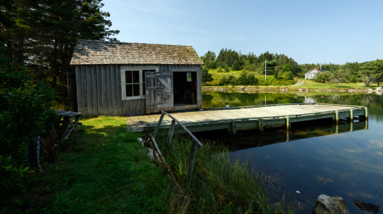 Wharf with a small shed in a calm day.