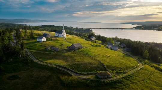 Areal view of a church on a green field