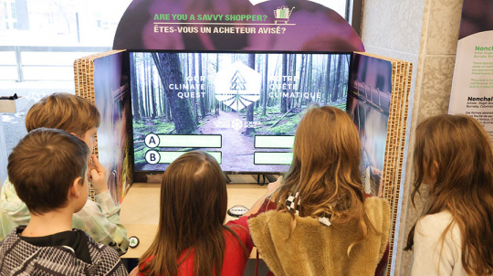 A group of kids shopping as part of the Climate quest exhibit