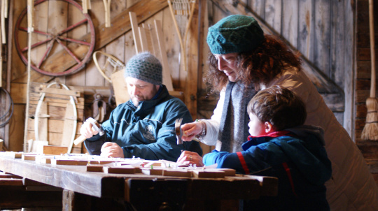 A family working in the shop at Ross Farm.