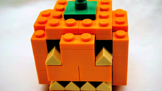 A small jack o' lantern made of LEGO.