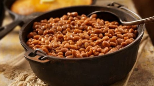 Cast iron pot of baked beans.